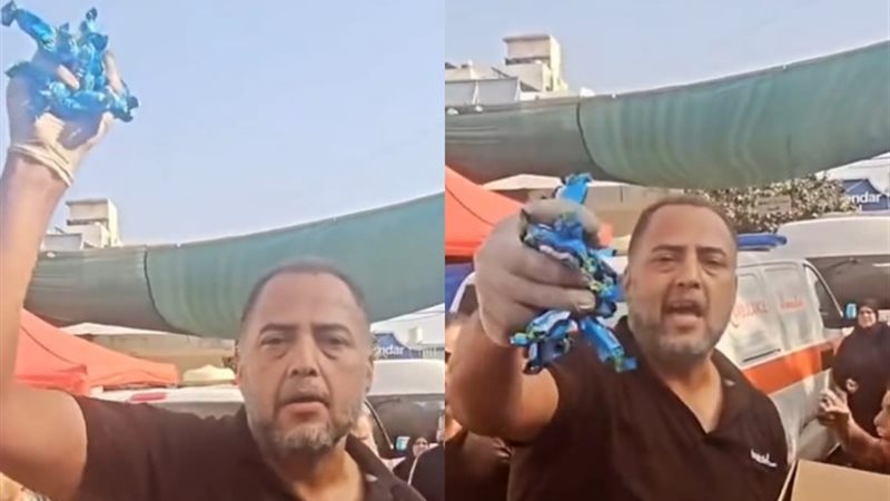 فلسطيني يوزع حلوى