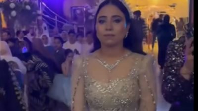 «كيد النسا» شقيقة شاب تخطف الأنظار من عروسته في حفل زفافه (فيديو)